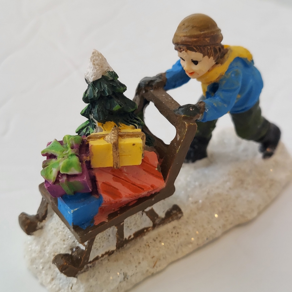 Boy Pushing Sled Gifts Christmas Village Figurine